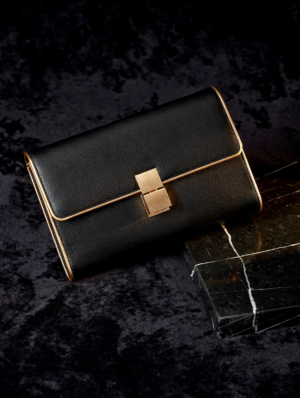 Structured evening clutch in caramel leather with seamless magnetic clasp
