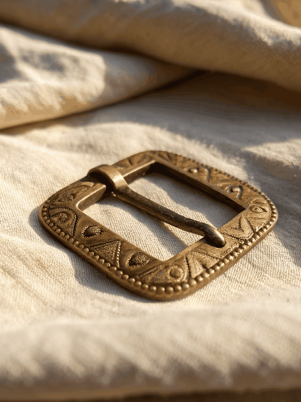 Custom decorative brass charm fitting with fine leather ribbon